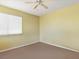 Bright bedroom featuring a single window and neutral carpet flooring at 1870 Desert Forest Way, Henderson, NV 89012