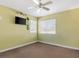 Bright bedroom featuring a ceiling fan and two windows for natural light at 1870 Desert Forest Way, Henderson, NV 89012
