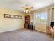Bedroom featuring a window, ceiling fan, carpet flooring, and traditional furnishings at 1870 Desert Forest Way, Henderson, NV 89012