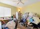 Cluttered bedroom showing personal items, a desk, and minimal furnishings at 1870 Desert Forest Way, Henderson, NV 89012