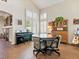 Bright dining area with tile floors, piano, and shutters on windows at 1870 Desert Forest Way, Henderson, NV 89012