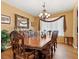 Formal dining room includes wood floors and large table perfect for entertaining at 1870 Desert Forest Way, Henderson, NV 89012