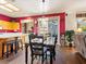 Cozy dining area with wood flooring, plenty of light, and a seamless transition to the kitchen at 1870 Desert Forest Way, Henderson, NV 89012