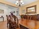 Spacious formal dining room with wood floors and antique furniture details at 1870 Desert Forest Way, Henderson, NV 89012