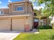 Charming two-story home with a well-manicured lawn, brick accents, and inviting curb appeal at 1870 Desert Forest Way, Henderson, NV 89012