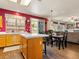 Open concept kitchen with an island adjacent to the dining and living area at 1870 Desert Forest Way, Henderson, NV 89012