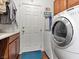 Functional laundry room with washer, dryer, and plenty of cabinet space at 1870 Desert Forest Way, Henderson, NV 89012