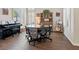 Bright living area with wood flooring, multiple windows, and ample space for Gathering and friends at 1870 Desert Forest Way, Henderson, NV 89012