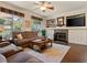 Inviting living room with fireplace, mantel, and backyard views at 1870 Desert Forest Way, Henderson, NV 89012