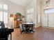 Bright living area with wood flooring, multiple windows, and ample space for Gathering and friends at 1870 Desert Forest Way, Henderson, NV 89012