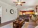 Open-concept living room with wood floors and view of the kitchen at 1870 Desert Forest Way, Henderson, NV 89012
