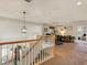 Upstairs loft area with stairs, carpeted floor, and a hanging light fixture at 1870 Desert Forest Way, Henderson, NV 89012