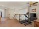 Upstairs loft area with a ceiling fan, a treadmill, and a carpeted floor at 1870 Desert Forest Way, Henderson, NV 89012