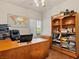 Home office with natural light, built in storage, and wood laminate flooring at 1870 Desert Forest Way, Henderson, NV 89012
