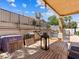 Covered patio featuring an outdoor seating area and grill for entertaining guests at 1870 Desert Forest Way, Henderson, NV 89012