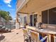 Covered outdoor seating on the home's patio near backyard pool at 1870 Desert Forest Way, Henderson, NV 89012