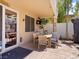 Covered patio area with outdoor dining table and a view of the backyard at 1870 Desert Forest Way, Henderson, NV 89012