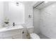 Modern bathroom features gray tile in the shower and a white vanity at 1916 Howard Ave, Las Vegas, NV 89104