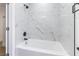 Modern bathtub features bright white tile with gray accents and black fixtures at 1916 Howard Ave, Las Vegas, NV 89104