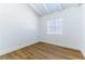 This bedroom features white walls, wood-look floors, and a bright window at 1916 Howard Ave, Las Vegas, NV 89104