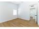 Spacious bedroom features wood-look floors and access to a hallway at 1916 Howard Ave, Las Vegas, NV 89104