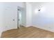 Bedroom featuring wood flooring, white walls, and ample closet space at 1916 Howard Ave, Las Vegas, NV 89104
