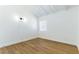 This bedroom features wood-look floors and a window at 1916 Howard Ave, Las Vegas, NV 89104