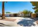 Charming single-story home features a covered parking area and a well-maintained front yard at 1916 Howard Ave, Las Vegas, NV 89104