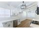 Bright kitchen with white cabinets, stainless dishwasher, and wood flooring at 1916 Howard Ave, Las Vegas, NV 89104