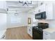 Modern eat-in kitchen with white cabinets, stainless appliances, and black hardware at 1916 Howard Ave, Las Vegas, NV 89104