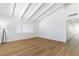 Bright living room featuring high vaulted ceilings, wood flooring and white walls at 1916 Howard Ave, Las Vegas, NV 89104