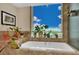 Bright bathroom with a large soaking tub and decorative plants at 2000 N Fashion Show Dr # 2222, Las Vegas, NV 89109
