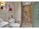 This bathroom has a tiled shower and toilet with modern fixtures at 2000 N Fashion Show Dr # 2222, Las Vegas, NV 89109