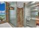 Luxury bathroom with glass shower, tile accents, and outside view at 2000 N Fashion Show Dr # 2222, Las Vegas, NV 89109