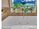 Bathroom features soaking tub with jet and garden plants at 2000 N Fashion Show Dr # 2222, Las Vegas, NV 89109