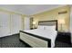 The bedroom features carpet, a bed with white linens, and nightstands with lamps at 2000 N Fashion Show Dr # 2222, Las Vegas, NV 89109