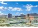 Expansive city view featuring numerous buildings and highways under a bright blue sky with fluffy clouds at 2000 N Fashion Show Dr # 2222, Las Vegas, NV 89109