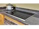 Close-up of the kitchen's electric cooktop with granite countertops and stainless oven at 2000 N Fashion Show Dr # 2222, Las Vegas, NV 89109