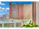 View of Resorts World Hotel from condo window with pools and palm trees at 2000 N Fashion Show Dr # 2222, Las Vegas, NV 89109