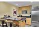 Kitchen features bar seating, stainless steel appliances, and light wood cabinetry at 2000 N Fashion Show Dr # 2222, Las Vegas, NV 89109