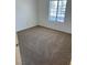 Bedroom featuring neutral carpeting and a window providing natural light at 2019 Rancho Lake Dr # 102, Las Vegas, NV 89108