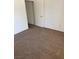 Bedroom with neutral carpeting and a standard closet with double doors at 2019 Rancho Lake Dr # 102, Las Vegas, NV 89108