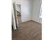 Neutral bedroom features an open door and a view of the window at 2019 Rancho Lake Dr # 102, Las Vegas, NV 89108