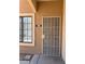 Apartment 102 with a screen door and a window to the left at 2019 Rancho Lake Dr # 102, Las Vegas, NV 89108