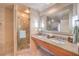 Elegant bathroom with granite counters, dual sinks and glass enclosed shower at 211 E Flamingo Rd # 402, Las Vegas, NV 89169
