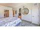 Bright bedroom with large bed, neutral tones and doorway views to other rooms at 211 E Flamingo Rd # 402, Las Vegas, NV 89169