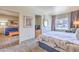 Spacious bedroom with large bed, sitting area, and expansive window views at 211 E Flamingo Rd # 402, Las Vegas, NV 89169