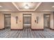 View of the three elevators and patterned carpet of the building at 211 E Flamingo Rd # 402, Las Vegas, NV 89169