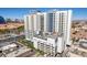 Exterior view of the Platinum Hotel and Spa featuring a rooftop pool and surrounding buildings at 211 E Flamingo Rd # 402, Las Vegas, NV 89169