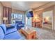 Living room featuring modern decor, balcony with city views, and a work desk at 211 E Flamingo Rd # 402, Las Vegas, NV 89169